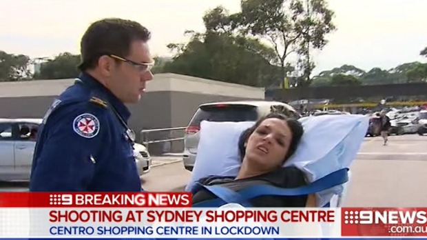 A woman is wheeled away by paramedics after the shooting at Bankstown Central Shopping Centre. Photo: Nine News
A woman is wheeled away by paramedics after the shooting at Bankstown Central Shopping Centre. Photo: Nine News