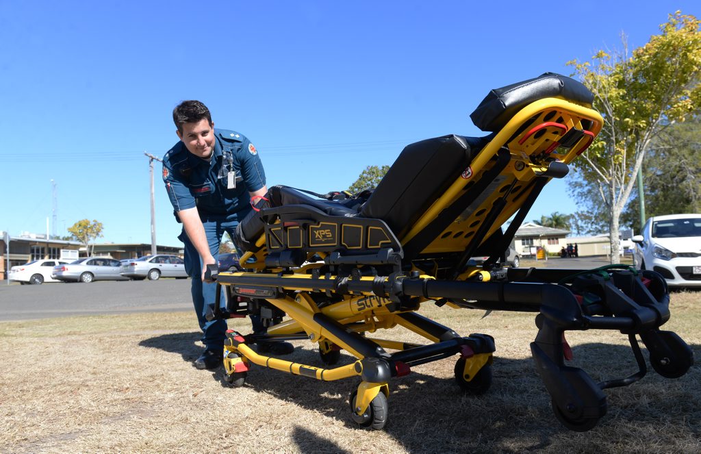 EASIER LIFT: Clinical support officer Cameron Anderson demonstrates the new pneumatic stretcher being introduced to alleviate the problem of back strain amongst paramedics. Photo: Mike Knott / NewsMail EASIER LIFT: Clinical support officer Cameron Anderson demonstrates the new pneumatic stretcher being introduced to alleviate the problem of back strain amongst paramedics. Photo: Mike Knott / NewsMail