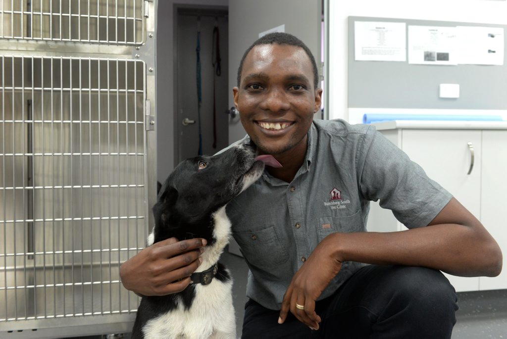 FACES OF BUNDABERG: Vet Clarence Bere and his dog Muchie enjoying time together at Bundaberg South Vet Clinic. Photo: Mike Knott / NewsMail FACES OF BUNDABERG: Vet Clarence Bere and his dog Muchie enjoying time together at Bundaberg South Vet Clinic. Photo: Mike Knott / NewsMail