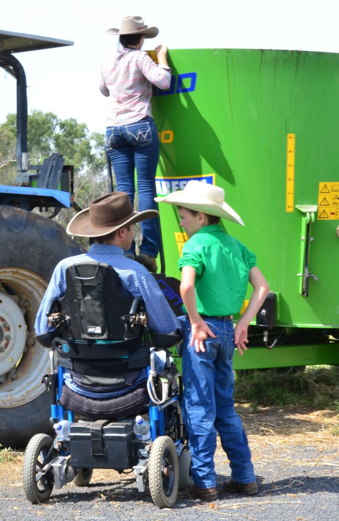 ON THE LAND: Rob Cook talks about the day ahead to Lawson Cook as Sarah Cook prepares feed for the cattle. Photo: Ben Turnbull ON THE LAND: Rob Cook talks about the day ahead to Lawson Cook as Sarah Cook prepares feed for the cattle. Photo: Ben Turnbull