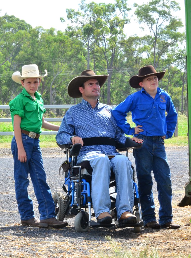 BIG DAY AHEAD: Lawson, Rob and Braxton Cook prepare feed for the cattle at Tandara. Photo: Ben Turnbull BIG DAY AHEAD: Lawson, Rob and Braxton Cook prepare feed for the cattle at Tandara. Photo: Ben Turnbull
