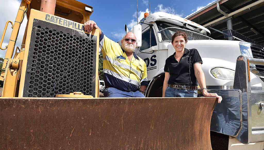 SDS TRAINING: Gary Smith and CEO Sharon Gough with a Caterpillar D3 dozer and a prime mover that are used for training. SDS TRAINING: Gary Smith and CEO Sharon Gough with a Caterpillar D3 dozer and a prime mover that are used for training.