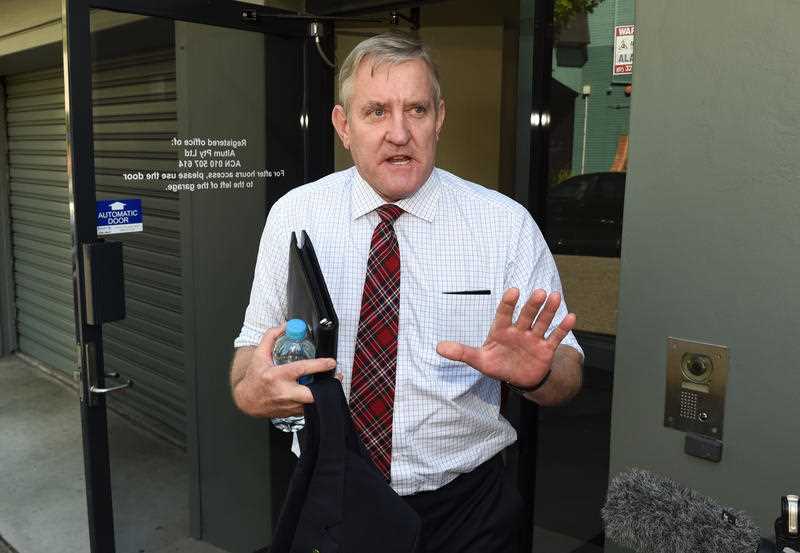 Federal member for Groom Ian Macfarlane leaves the the Liberal National Party's (LNP) Queensland headquarters in Brisbane, Monday, Dec. 14, 2015. The LNP has announced it will not support Macfarlane's move to The Nationals Party room in Canberra. Federal member for Groom Ian Macfarlane leaves the the Liberal National Party's (LNP) Queensland headquarters in Brisbane, Monday, Dec. 14, 2015. The LNP has announced it will not support Macfarlane's move to The Nationals Party room in Canberra.