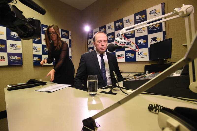 Australian Minister for Immigration Peter Dutton arrives at a radio station for a media interview, in the Press Gallery at Parliament House in Canberra, Thursday, May 5, 2016. Australian Minister for Immigration Peter Dutton arrives at a radio station for a media interview, in the Press Gallery at Parliament House in Canberra, Thursday, May 5, 2016.
