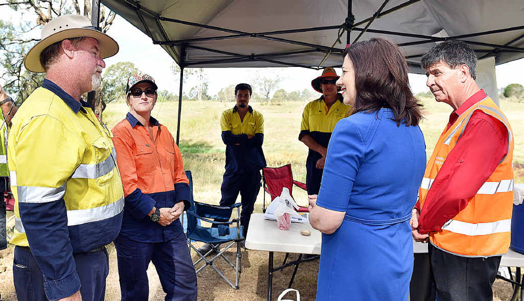 The Queensland Premier Annastacia Palaszczuk with superviser Wayne Kelly and trainee Mandy Stollberg at the the Fraser Coast TESS farm worksite. The Queensland Premier Annastacia Palaszczuk with superviser Wayne Kelly and trainee Mandy Stollberg at the the Fraser Coast TESS farm worksite.