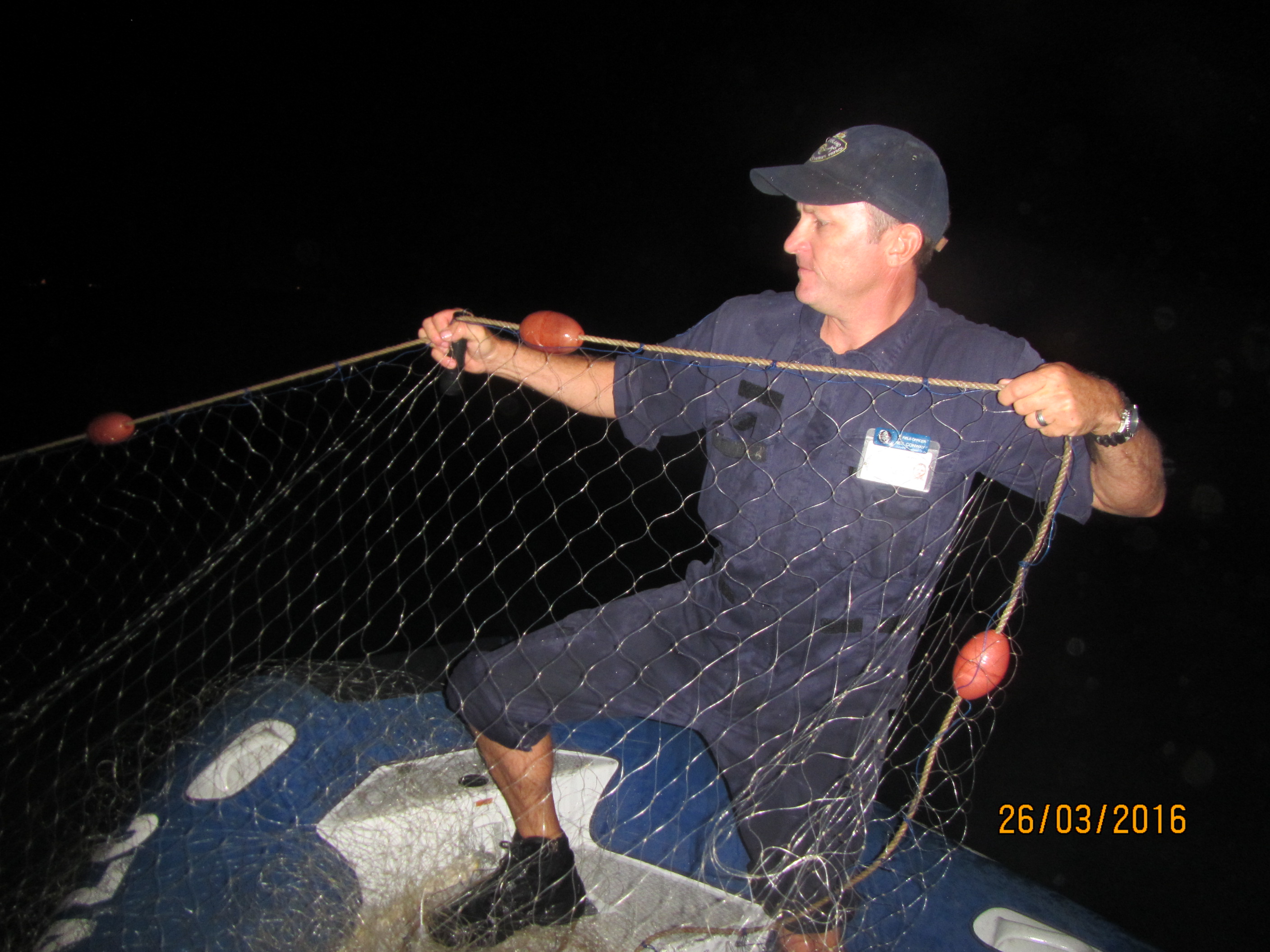 Queensland Boating and Fisheries Patrol officer Neil Conway recovering the net that was illegally used by two recreational fishermen in a Dugong Protection Area. Queensland Boating and Fisheries Patrol officer Neil Conway recovering the net that was illegally used by two recreational fishermen in a Dugong Protection Area.