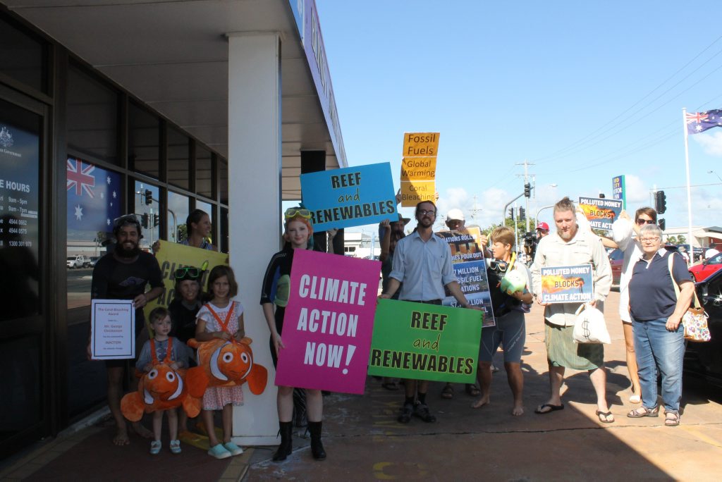 Protestors gathered outside member for Dawson George Christensen's Mackay office today to present him with the 'bleached coral cup' for Protestors gathered outside member for Dawson George Christensen's Mackay office today to present him with the 'bleached coral cup' for