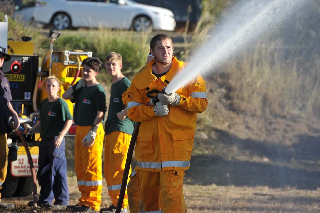 Toolooa State High School students complete their course so they can attend real fires. Photo Mike Richards / The Observer