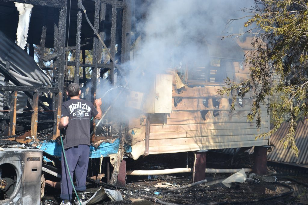 A farmhouse near the old Dalby dump on Dalby-Jandowae Rd was destroyed by a blaze last night, believed to have originated in the laundry. The couple in the house were able to escape, and began the cleanup today. A farmhouse near the old Dalby dump on Dalby-Jandowae Rd was destroyed by a blaze last night, believed to have originated in the laundry. The couple in the house were able to escape, and began the cleanup today.
