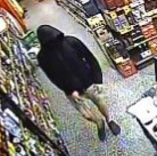 CCTV image of the man accused of robbing a bottle shop in Caloundra. CCTV image of the man accused of robbing a bottle shop in Caloundra.