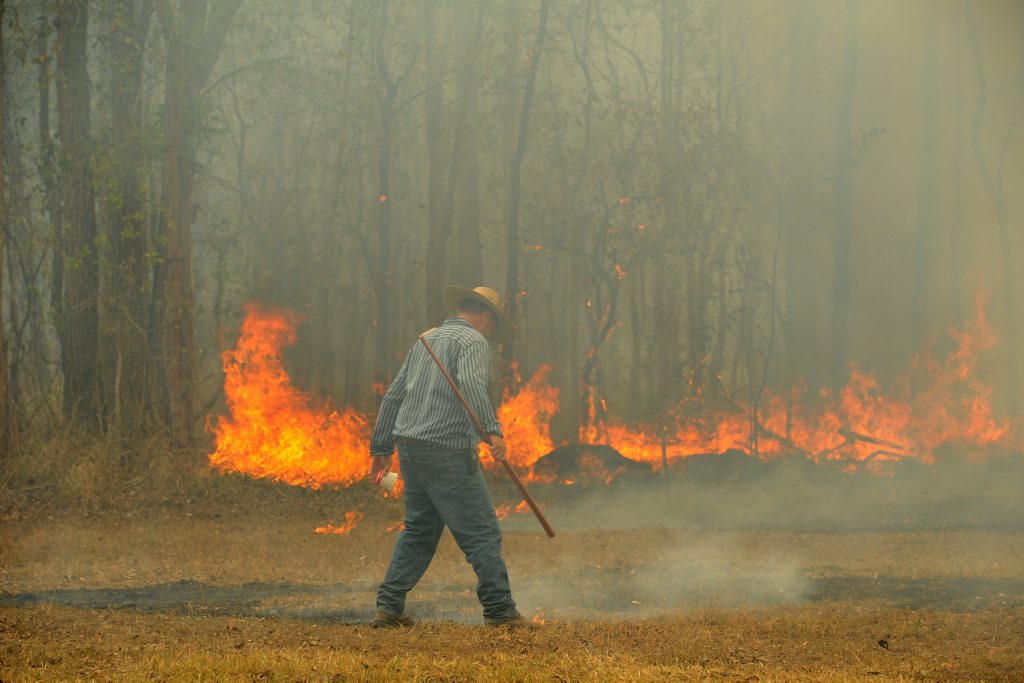 Barry Brunke helps put out a bushfire at the Maryborough Showgrounds on Saturday. Photo: Robyne Cuerel / Fraser Coast Chronicle Barry Brunke helps put out a bushfire at the Maryborough Showgrounds on Saturday. Photo: Robyne Cuerel / Fraser Coast Chronicle