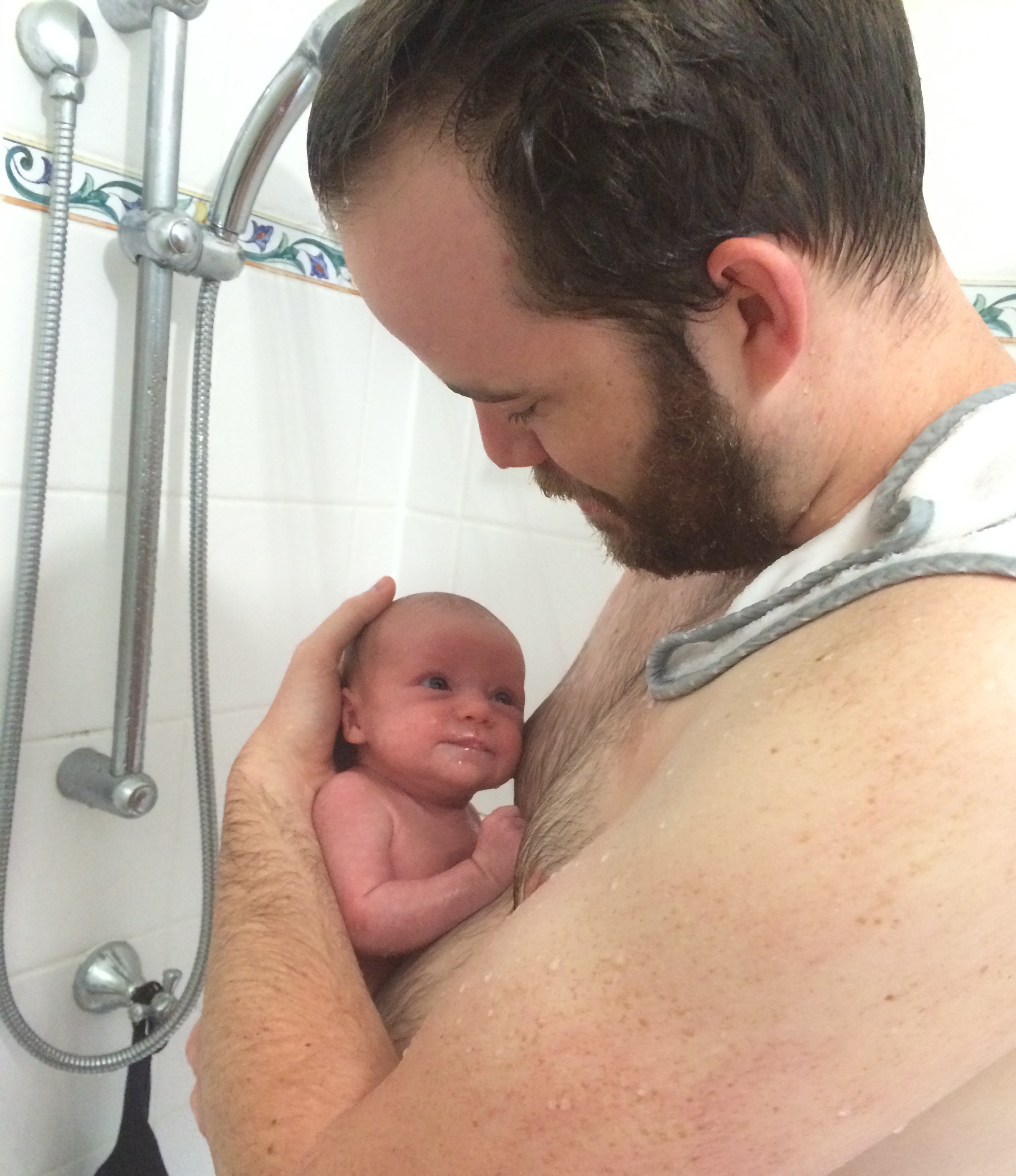 Journalist Owen Jacques holding his daughter during her first shower. Journalist Owen Jacques holding his daughter during her first shower.