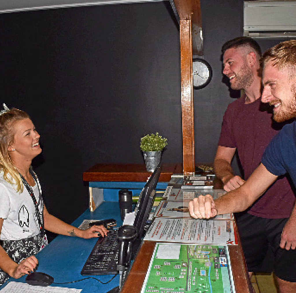 TAXED: Base employee and backpacker Henriikka Norra checks in Eoin O’Reilly and Lee Carter. TAXED: Base employee and backpacker Henriikka Norra checks in Eoin O’Reilly and Lee Carter.