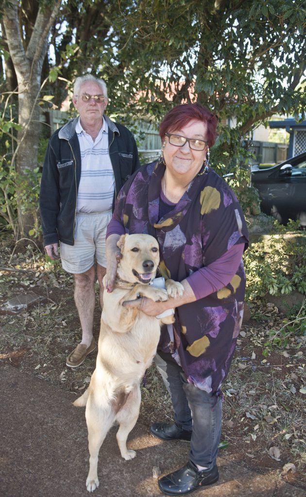 ALL SAFE: Dee Whittaker and Greg Whittaker with dog Raja outside their house after a fire in Herries St. ALL SAFE: Dee Whittaker and Greg Whittaker with dog Raja outside their house after a fire in Herries St.