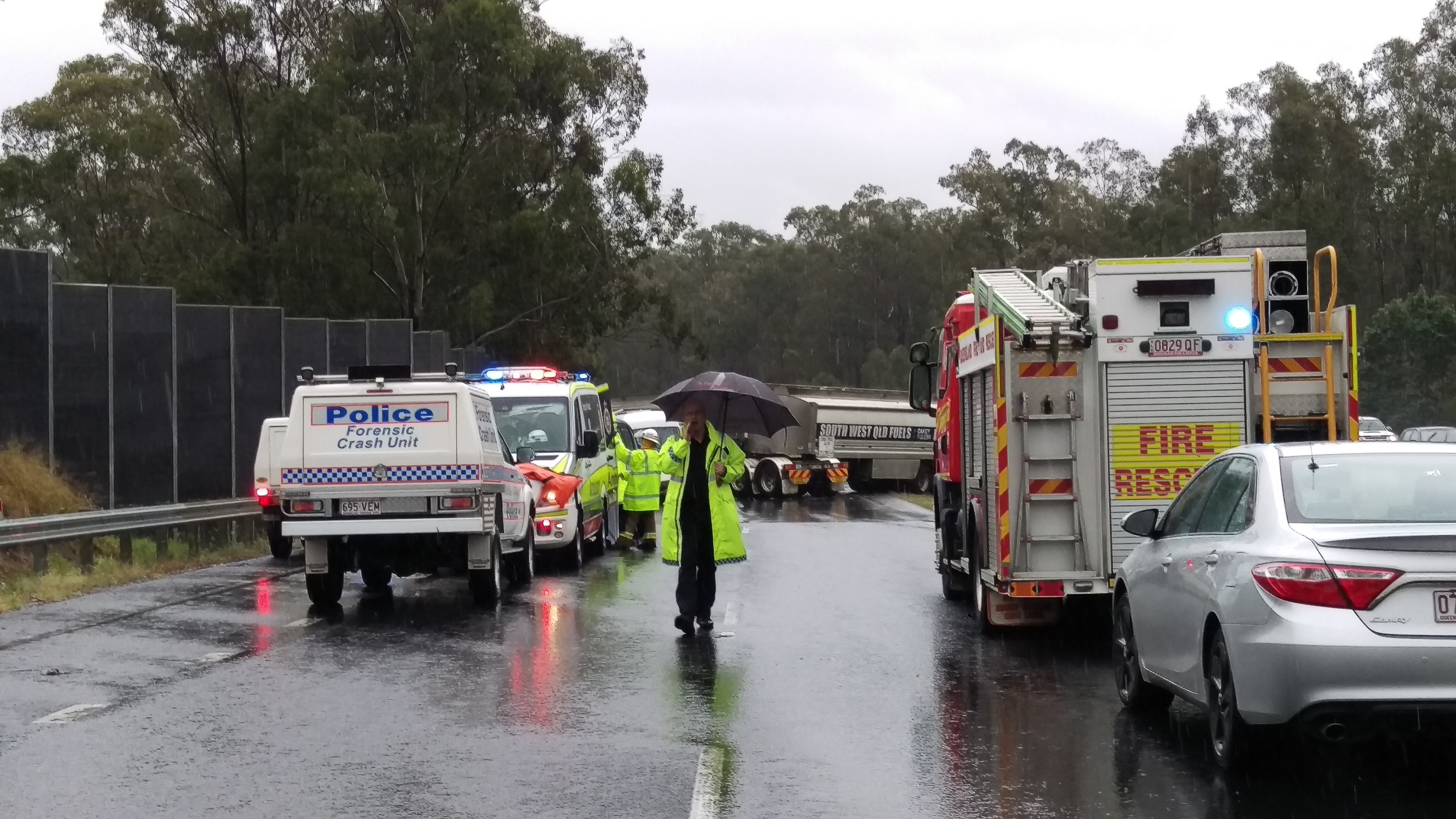 Emergency services at a crash scene at Kholo on Saturday morning. Emergency services at a crash scene at Kholo on Saturday morning.