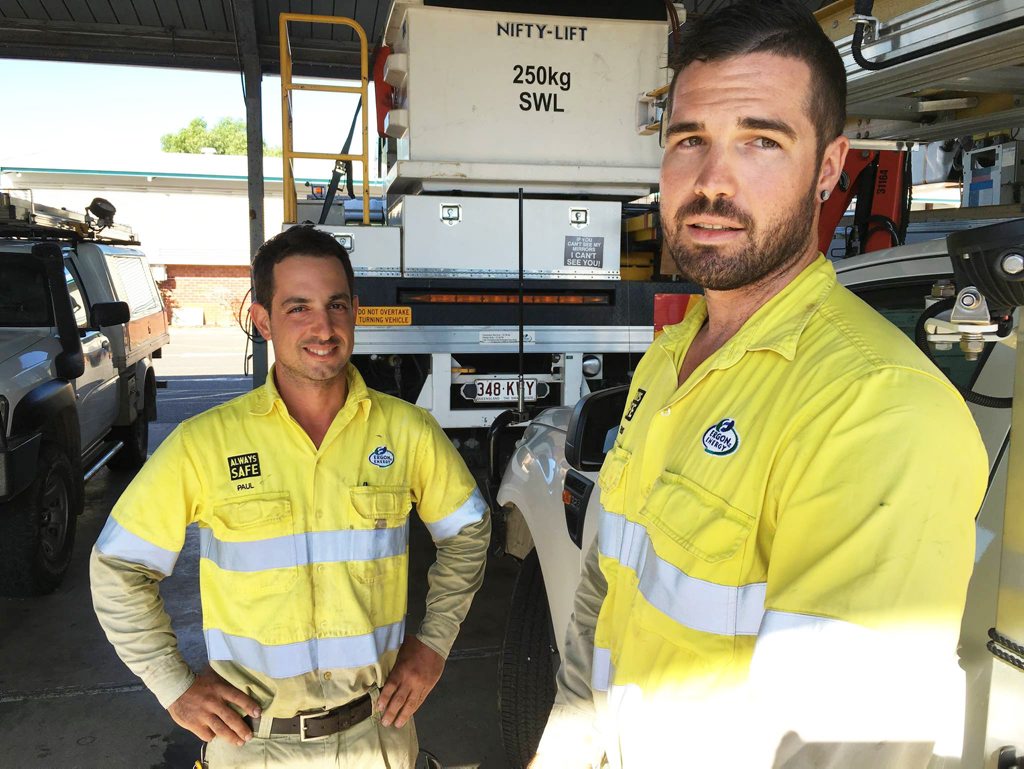 HEROES: Ergon Electrical tradesmen, Paul Sciuto and Trent Stephensen, came to the rescue when a tourist collapsed on a beach in Bowen. Photo contributed/John Fowler HEROES: Ergon Electrical tradesmen, Paul Sciuto and Trent Stephensen, came to the rescue when a tourist collapsed on a beach in Bowen. Photo contributed/John Fowler
