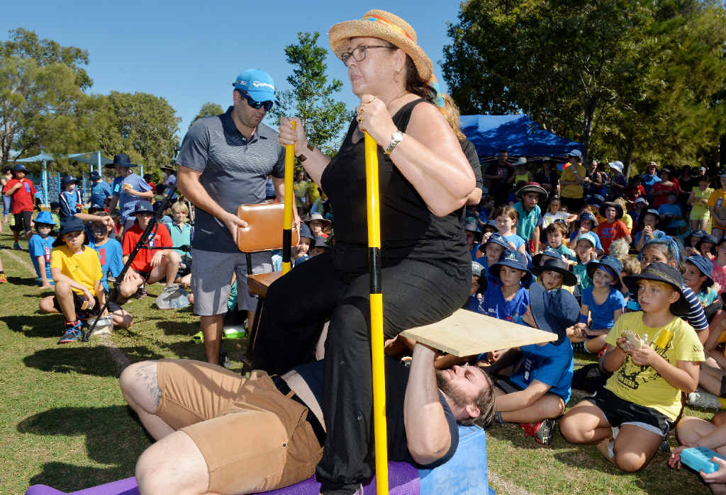 STRONG MAN: Mitchell Eckford bench pressed his mum and Bucasia State School principal Belinda Eckford, to help raise awareness for school chaplains and inspire younger children at the school to follow their dreams. STRONG MAN: Mitchell Eckford bench pressed his mum and Bucasia State School principal Belinda Eckford, to help raise awareness for school chaplains and inspire younger children at the school to follow their dreams.