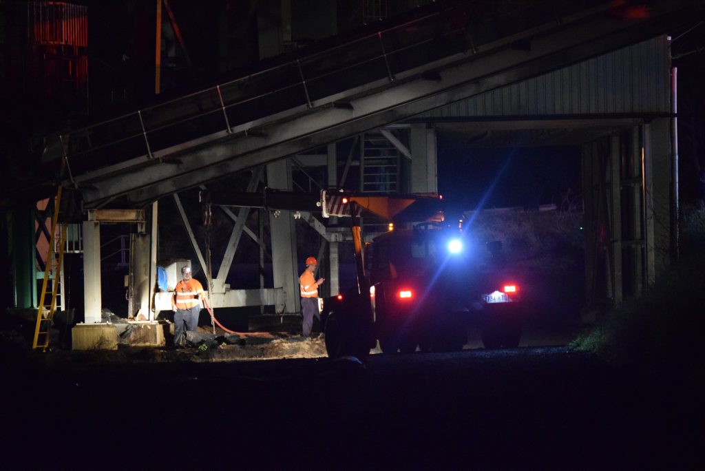 Mill workers inspect the damage to the Millaquin Mill overnight. Photo: Craig Warhurst/News mail Mill workers inspect the damage to the Millaquin Mill overnight. Photo: Craig Warhurst/News mail
