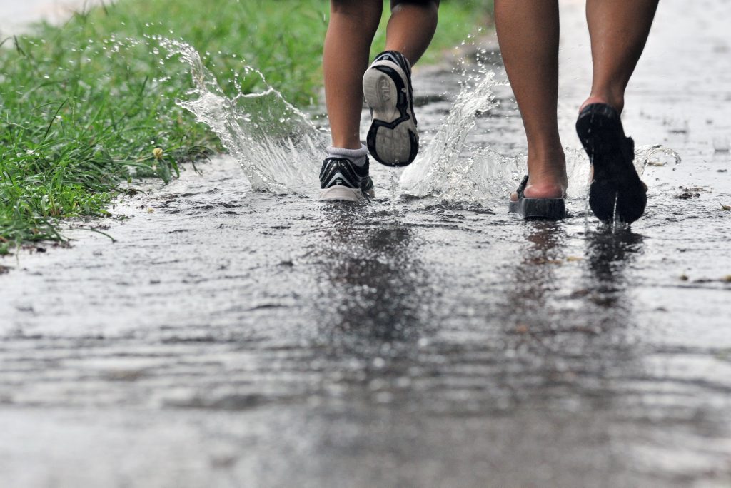 Wet weather makes it a struggle to pick up the children from school. Photo Brenda Strong / The Observer Wet weather makes it a struggle to pick up the children from school. Photo Brenda Strong / The Observer