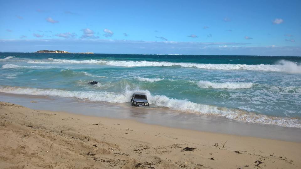 Two vehicles being consumed by waves in Western Australia had to be recovered by the SES. Two vehicles being consumed by waves in Western Australia had to be recovered by the SES.