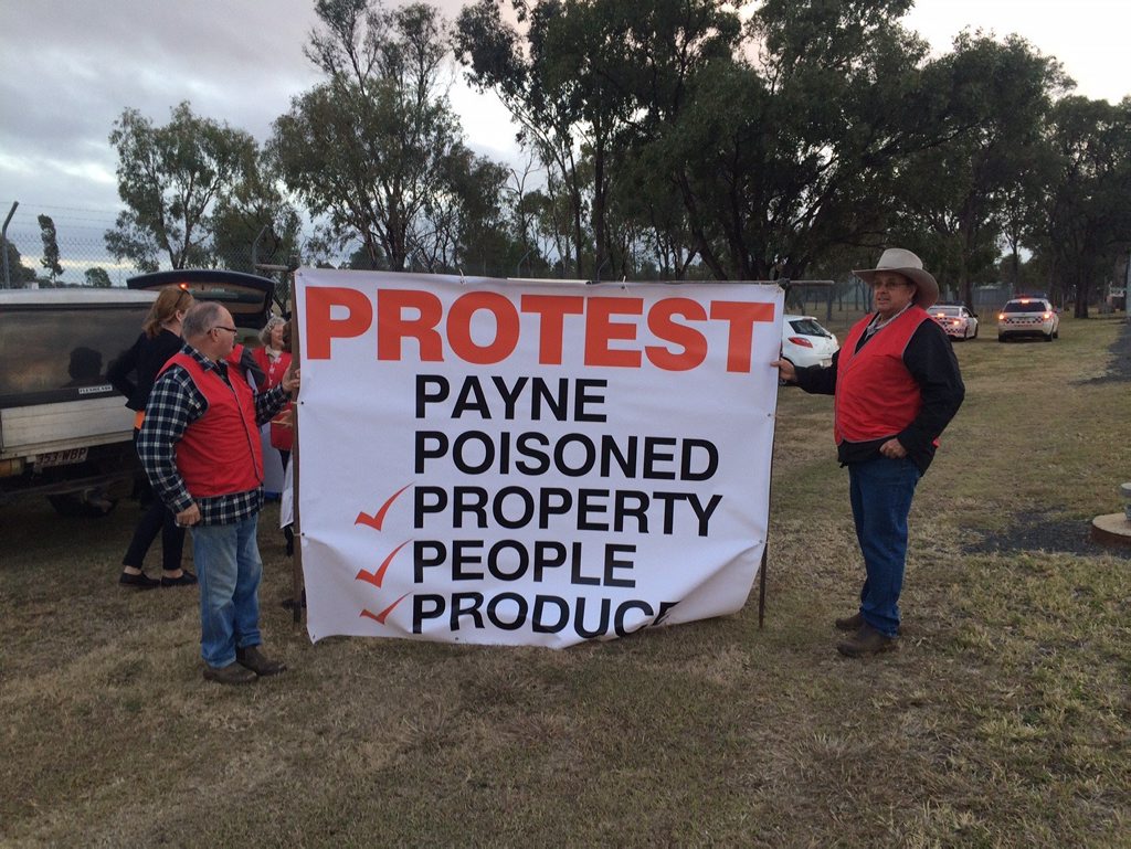 Oakey resident of 25 years Peter Jones, whose house neighbours the base, and David Jefferis of Berwick Stud hold the sign leading to the base this morning. Oakey resident of 25 years Peter Jones, whose house neighbours the base, and David Jefferis of Berwick Stud hold the sign leading to the base this morning.