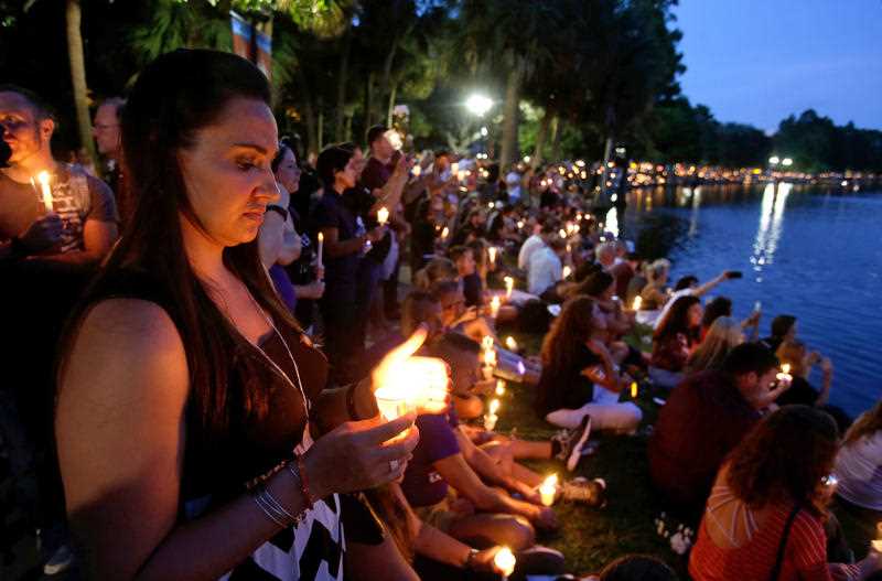Supporters of the victims of the recent mass shooting at the Pulse nightclub attend a vigil at Lake Eola Park, Sunday, June 19, 2016, Orlando, Fla. Tens of thousands of people attended the vigil. Supporters of the victims of the recent mass shooting at the Pulse nightclub attend a vigil at Lake Eola Park, Sunday, June 19, 2016, Orlando, Fla. Tens of thousands of people attended the vigil.