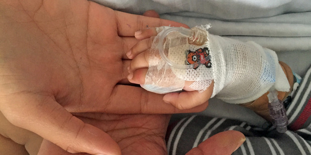 Baby Hamish is battling meningococcal meningitis in Tauranga Hospital. Mum Ashley holds his hand, with grandmother Charmaigne.
Baby Hamish is battling meningococcal meningitis in Tauranga Hospital. Mum Ashley holds his hand, with grandmother Charmaigne.
