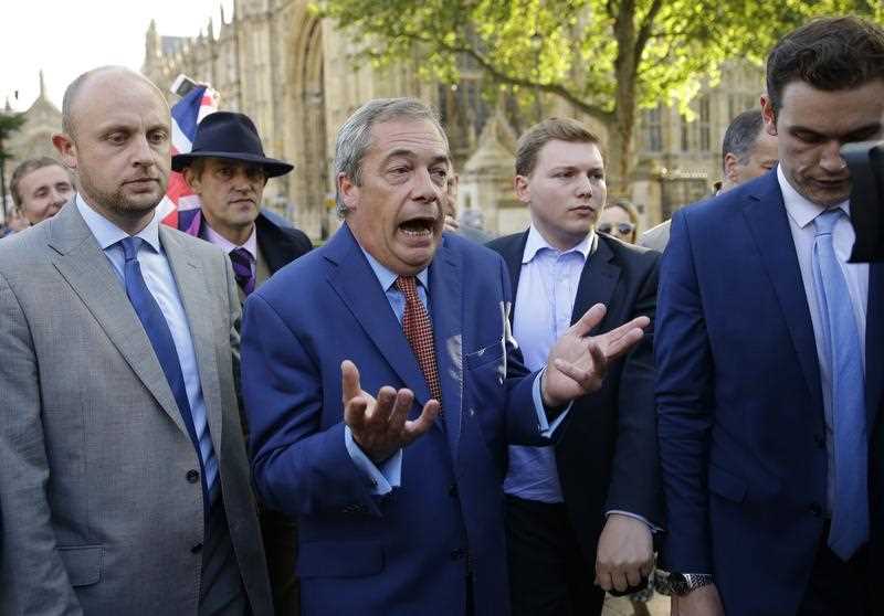 Nigel Farage, the leader of the UK Independence Party speaks to the media on College Green in London, Friday, June 24, 2016. Britain voted to leave the European Union after a bitterly divisive referendum campaign, according to tallies of official results Friday. Nigel Farage, the leader of the UK Independence Party speaks to the media on College Green in London, Friday, June 24, 2016. Britain voted to leave the European Union after a bitterly divisive referendum campaign, according to tallies of official results Friday.