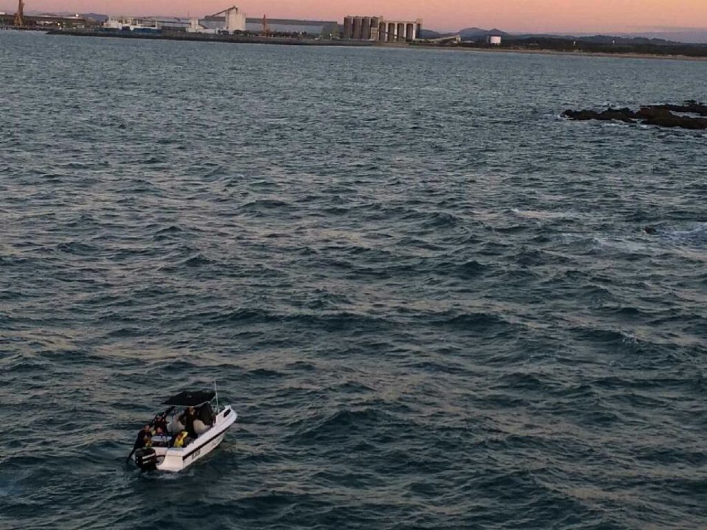 CQ Rescue took this photo of a civilian boat taking the four men back to shore. Contributed CQ Rescue took this photo of a civilian boat taking the four men back to shore. Contributed