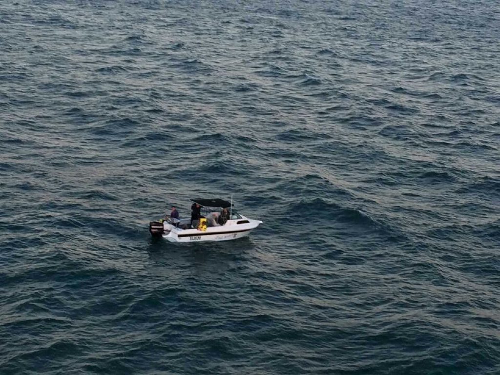 A civilian boat took the four men back to shore as their 21 ft boat had sunk completely. A civilian boat took the four men back to shore as their 21 ft boat had sunk completely.