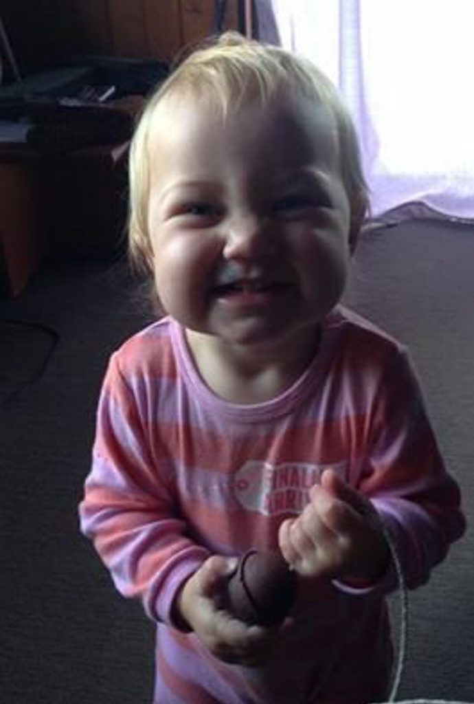 The girl is Caucasian in appearance, with blonde hair. The girl is Caucasian in appearance, with blonde hair.