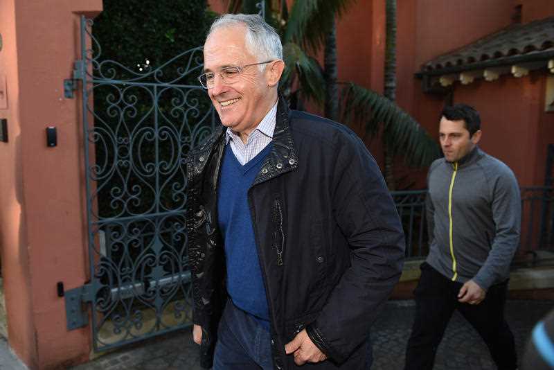 Australian Prime Minister Malcolm Turnbull along with son Alex, (right), leaves his home in Sydney, Monday, July 4, 2016. The result of Saturday's federal election is yet to be decided as both major parties wait for the Australian Electoral Commission to continue the vote count on Tuesday, with around 13 seats still undecided. Australian Prime Minister Malcolm Turnbull along with son Alex, (right), leaves his home in Sydney, Monday, July 4, 2016. The result of Saturday's federal election is yet to be decided as both major parties wait for the Australian Electoral Commission to continue the vote count on Tuesday, with around 13 seats still undecided.