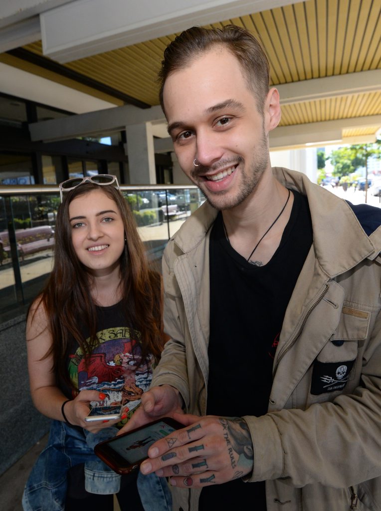 L-R Sarah Simic and Evan Tracy playing Pokemon in East Street Rockhampton. Photo: Chris Ison / The Morning Bulletin L-R Sarah Simic and Evan Tracy playing Pokemon in East Street Rockhampton. Photo: Chris Ison / The Morning Bulletin