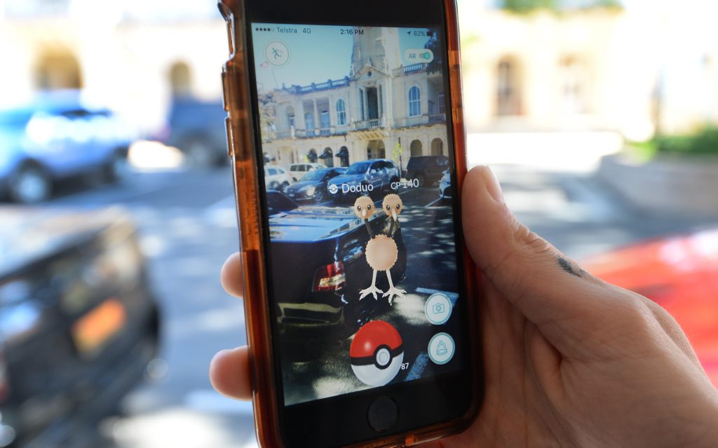 Evan Tracy playing Pokemon in East Street Rockhampton. Photo: Chris Ison / The Morning Bulletin Evan Tracy playing Pokemon in East Street Rockhampton. Photo: Chris Ison / The Morning Bulletin