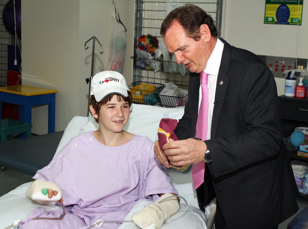 Ipswich Mayor Paul Pisasale visited Michael Boggan in hospital. Photo: Contributed Ipswich Mayor Paul Pisasale visited Michael Boggan in hospital. Photo: Contributed