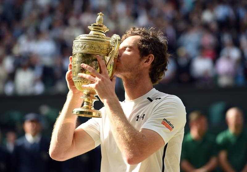 Andy Murray of Britain kisses the championship trophy following his win over Milos Raonic of Canada in the men's singles final of the Wimbledon Championships at the All England Lawn Tennis Club, in London, Britain, 10 July 2016. Andy Murray of Britain kisses the championship trophy following his win over Milos Raonic of Canada in the men's singles final of the Wimbledon Championships at the All England Lawn Tennis Club, in London, Britain, 10 July 2016.