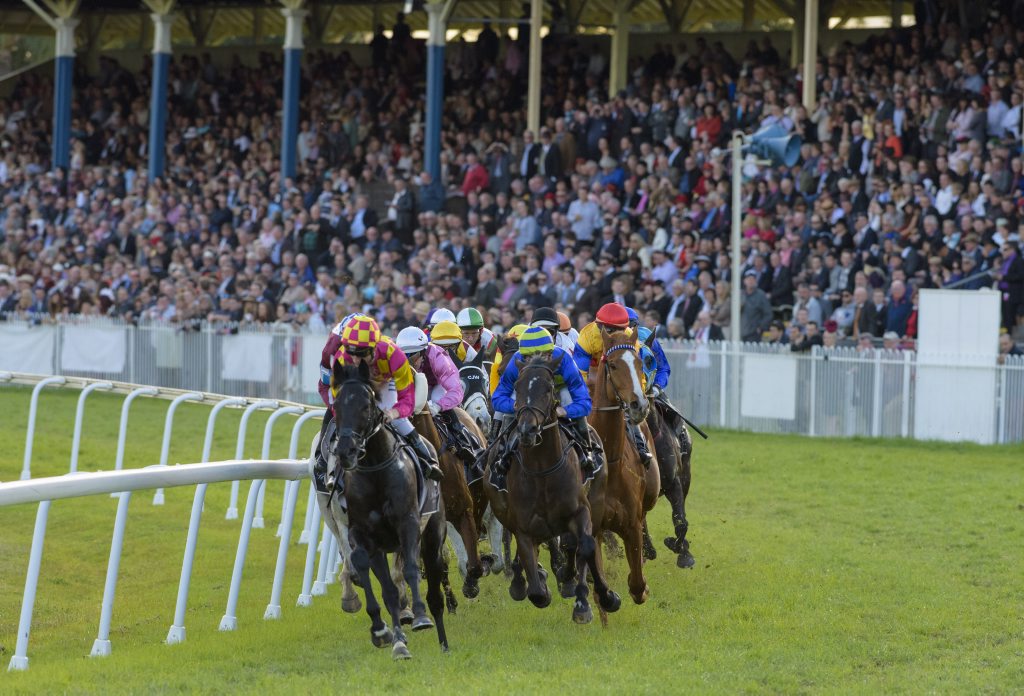 Blake Shinn takes top weight Bonfire to the lead around the first corner in front of the main straight - and held onto win the 2015 Grafton CupPhoto Adam Hourigan / The Daily Examiner