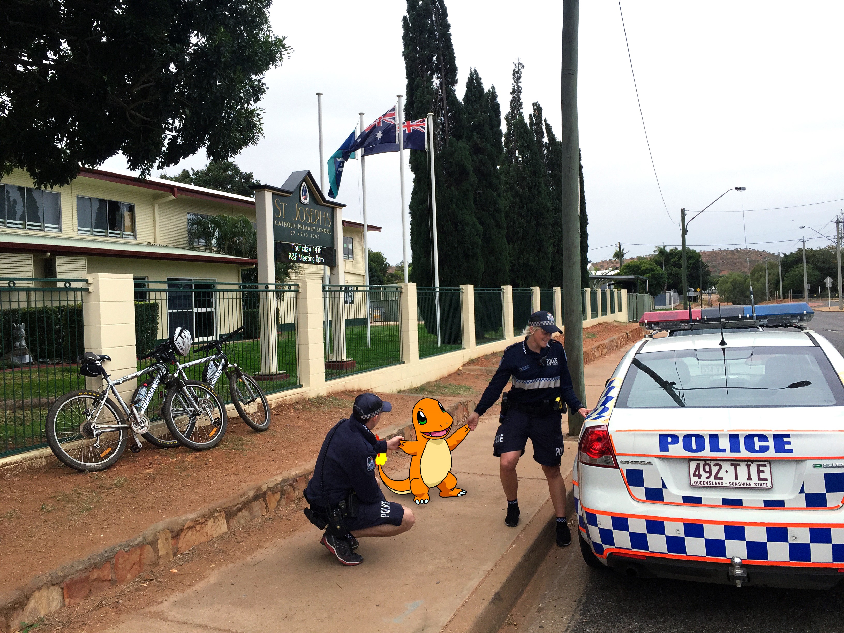 No Pokémon here. Police help to relocate Charmander from the school grounds. No Pokémon here. Police help to relocate Charmander from the school grounds.