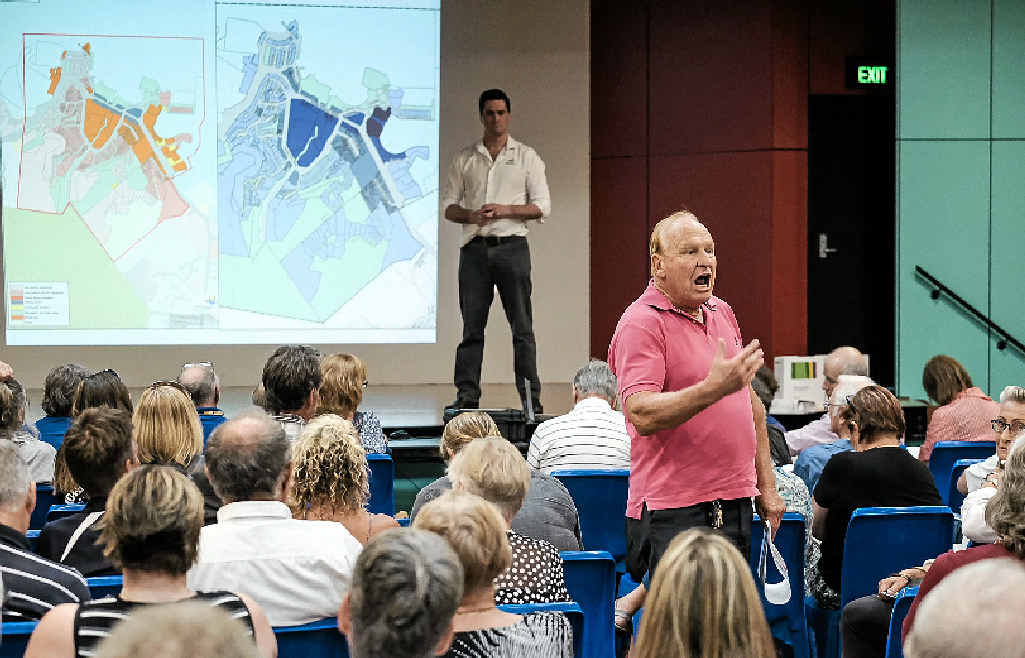NEW PLAN: Roger Down channels the anger in the room at a meeting in September 2015 over Whitsunday Regional Council’s original proposed draft planning scheme, which would have seen building heights lifted to eight and 12 storeys in parts of Airlie Beach. NEW PLAN: Roger Down channels the anger in the room at a meeting in September 2015 over Whitsunday Regional Council’s original proposed draft planning scheme, which would have seen building heights lifted to eight and 12 storeys in parts of Airlie Beach.