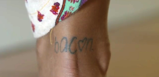 Noni Janur's bacon tattoo in a scene from The Bachelor. Noni Janur's bacon tattoo in a scene from The Bachelor.