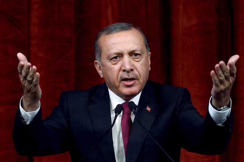 Turkey President Recep Tayyip Erdogan delivers a speech commenting on those killed and wounded during a failed July 15 military coup, in Ankara, Turkey, late Friday, July 29, 2016. The government crackdown in the coup's aftermath has strained Turkey's ties with key allies including the United States. Turkey President Recep Tayyip Erdogan delivers a speech commenting on those killed and wounded during a failed July 15 military coup, in Ankara, Turkey, late Friday, July 29, 2016. The government crackdown in the coup's aftermath has strained Turkey's ties with key allies including the United States.