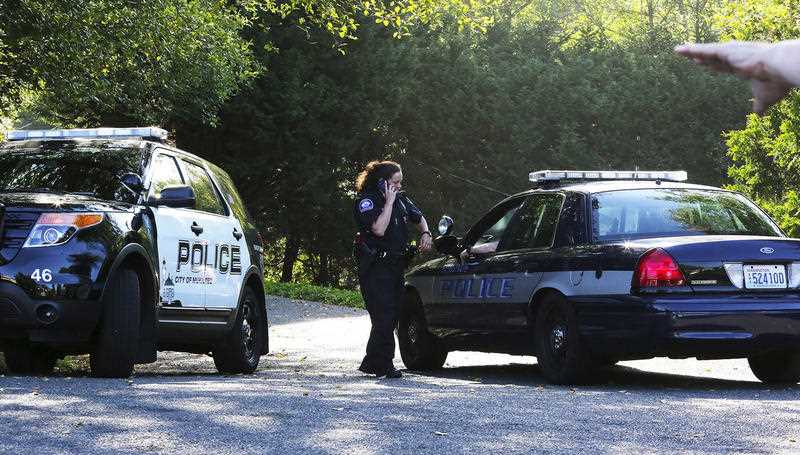 Mukilteo police monitor the access point to the crime scene from a block away, after a shooting in Mukilteo, Wash., Saturday July 30, 2016. A suspect was apprehended three counties away, said Officer Myron Travis of the Mukilteo Police Department. Mukilteo police monitor the access point to the crime scene from a block away, after a shooting in Mukilteo, Wash., Saturday July 30, 2016. A suspect was apprehended three counties away, said Officer Myron Travis of the Mukilteo Police Department.