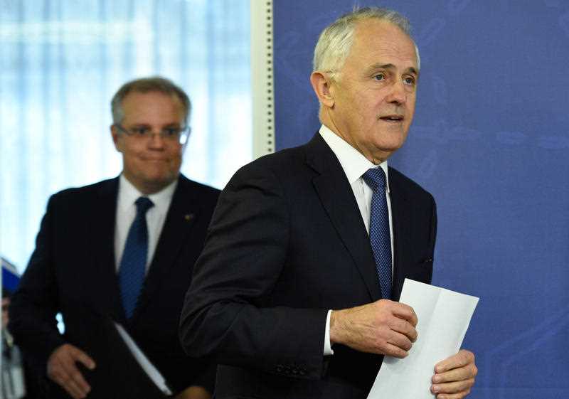 Treasurer Scott Morrison and Prime Minister Malcolm Turnbull arrive to speak at a press conference in Sydney, Thursday, Aug. 4, 2016. Prime Minister Malcolm Turnbull will ask parliament to require the major banks to face a committee inquiry at least once a year. Treasurer Scott Morrison and Prime Minister Malcolm Turnbull arrive to speak at a press conference in Sydney, Thursday, Aug. 4, 2016. Prime Minister Malcolm Turnbull will ask parliament to require the major banks to face a committee inquiry at least once a year.