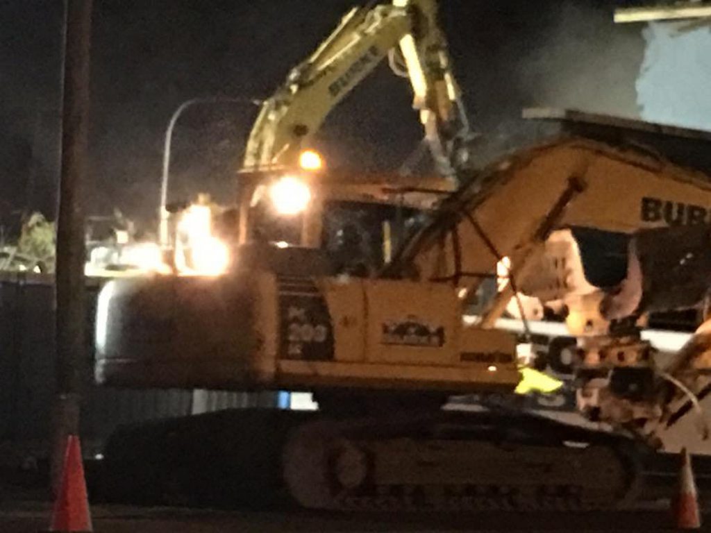 Workers demolish the building. Photo Contributed Workers demolish the building. Photo Contributed