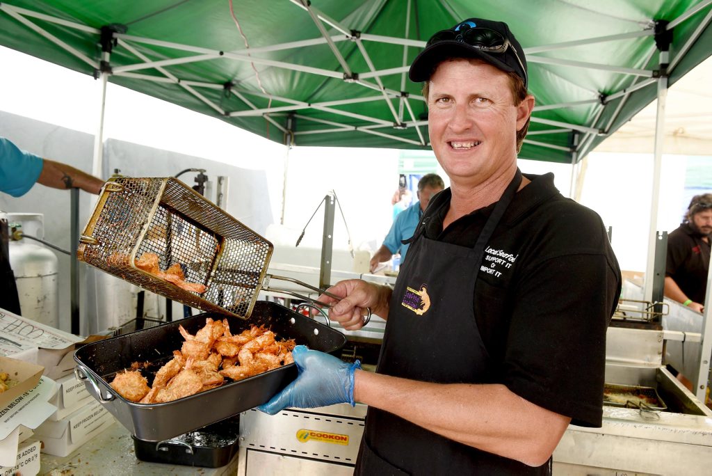 Hervey Bay Seafood Festival - Local fisherman Brett Fuchs kept the fryer busy cooking up the popular plate of coconut prawns. Hervey Bay Seafood Festival - Local fisherman Brett Fuchs kept the fryer busy cooking up the popular plate of coconut prawns.