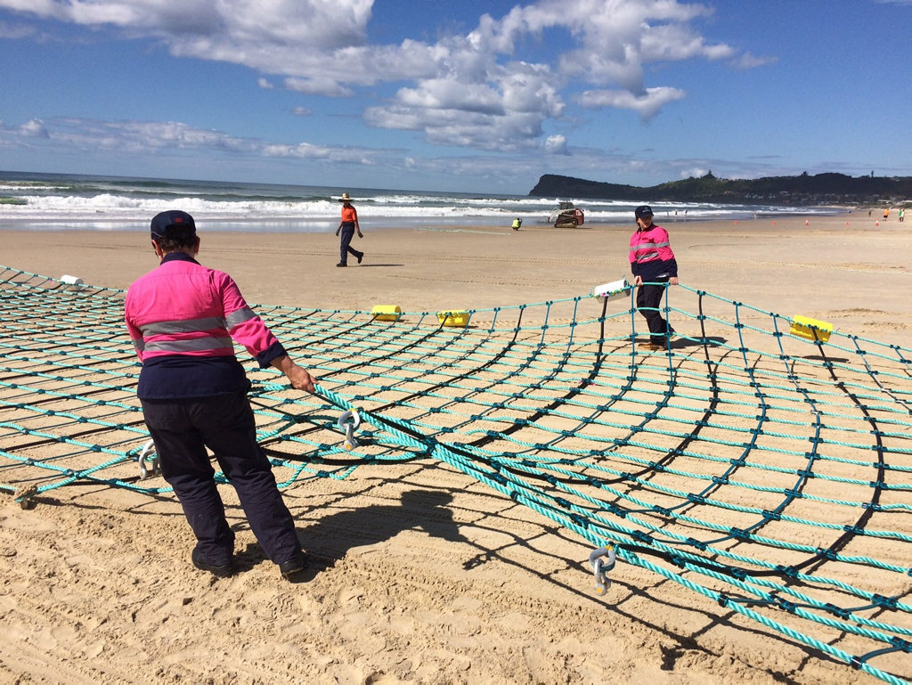 Work has begun this morning to float the shark barrier into place at Lennox Head. Work has begun this morning to float the shark barrier into place at Lennox Head.