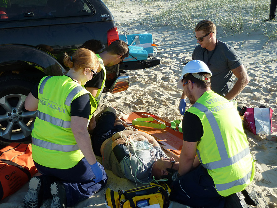 University of the Sunshine Coast Bachelor of Paramedic Science students working on ‘patients’ from a simulated vehicle rollover during a recent training event on Fraser Island. University of the Sunshine Coast Bachelor of Paramedic Science students working on ‘patients’ from a simulated vehicle rollover during a recent training event on Fraser Island.