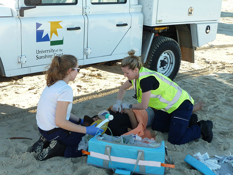 University of the Sunshine Coast Bachelor of Paramedic Science students working on ‘patients’ from a simulated vehicle rollover during a recent training event on Fraser Island. University of the Sunshine Coast Bachelor of Paramedic Science students working on ‘patients’ from a simulated vehicle rollover during a recent training event on Fraser Island.