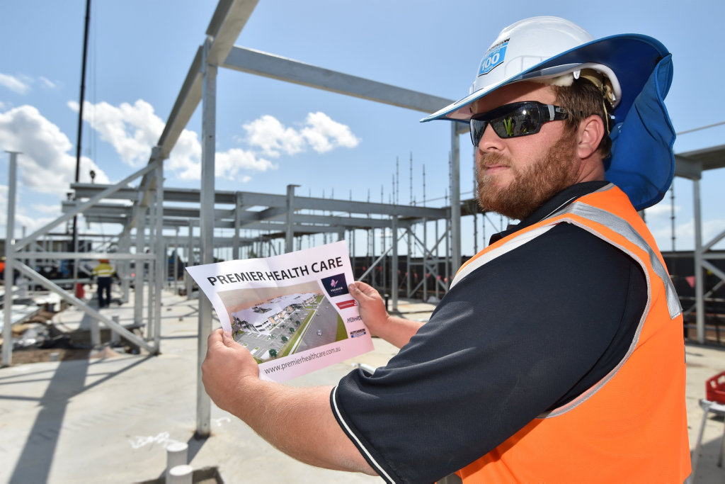 New aged care development in Medical Place at Urraween - 145 bed Premier Health Care building under construction - Clayton Ballard (snr. site mgr.) with an artists impression of the finished building. New aged care development in Medical Place at Urraween - 145 bed Premier Health Care building under construction - Clayton Ballard (snr. site mgr.) with an artists impression of the finished building.