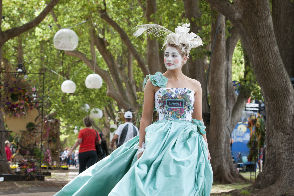 Emily Martin models fashion from Carolyn Taylor-Smith as part of the Culture to Couture event during the Ergon Energy Flower, Food and Wine Festival in Queens Park last year. 
